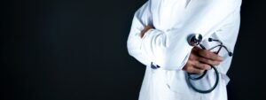 Doctor with stethoscope in office
